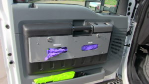 Integrated glove holders in cab doors