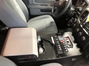 Custom front console with integrated storage compartment